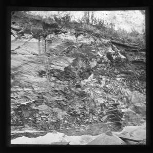 LDGSL/1088/JB/1 Black and white photograph showing a geological feature from Oxted, Surrey, by Johnson, Bird and Co, [1890s-1900s].   Partial caption 'Iron...?’