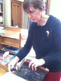 Society librarian Wendy Cawthorne demonstrates the badger hair shaving brush book brushing technique.