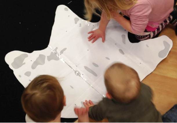 Comparing the size of hands to a life-sized triceratops footprint