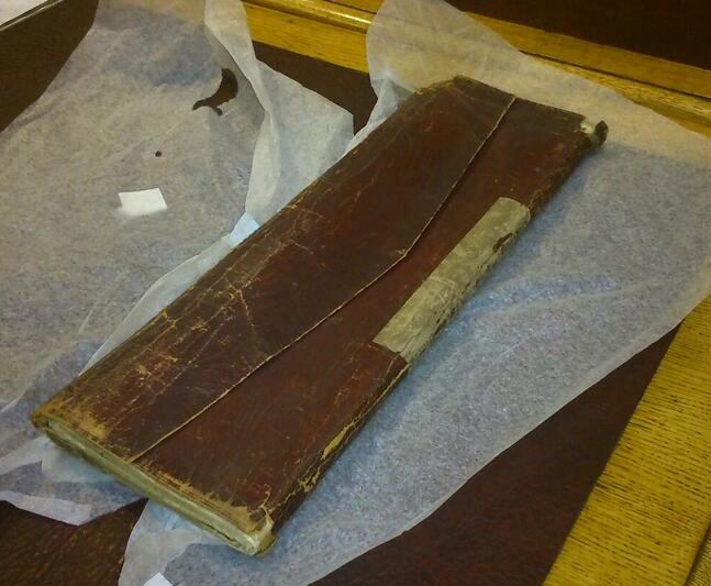 William Smith's map in its red leather portfolio