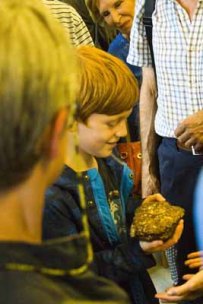 Visitors with the Society's meteorite